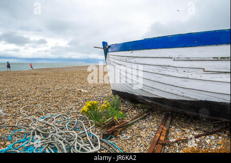 Fishing boat beached onto the shingle beach at Aldeburgh, Suffolk, Stock Photo