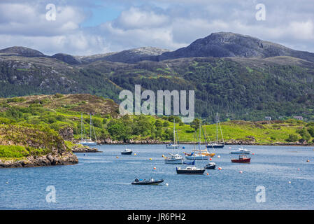 Sailing boats in natural harbour at Badachro near Gairloch on the shore of Gair Loch, Ross and Cromarty, Scotland, UK Stock Photo