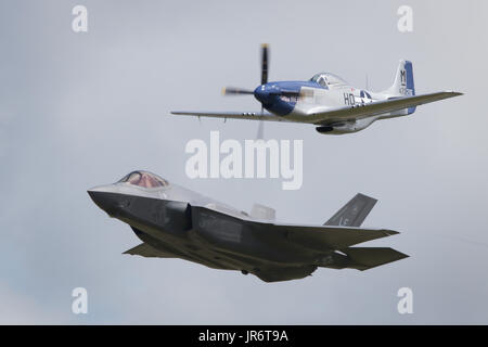 Fairford, Gloucestershire, UK - July 10th, 2016: An RAF Lockheed Martin F-35 Lightning II & P-51 Mustang Heritage Flight at International Air Tattoo Stock Photo