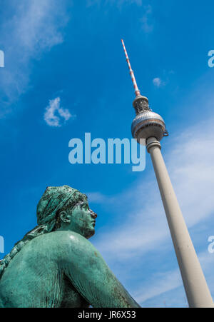 Neptune fountain and TV Tower at Alexanderplatz square, Berlin, Germany Stock Photo