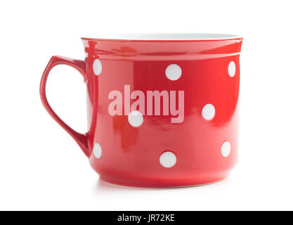 Red and white spotted mug isolated on white background. Stock Photo
