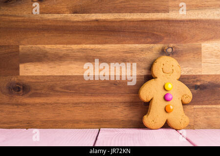 Gingerbread man leaning against the wall. Xmas gingerbread. Stock Photo