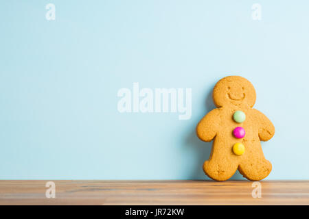 Gingerbread man leaning against the wall. Xmas gingerbread. Stock Photo