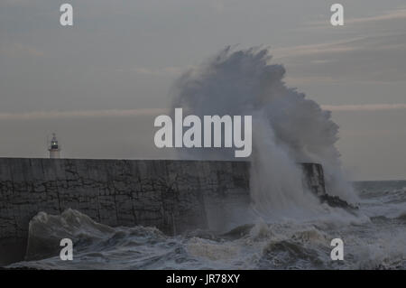 Newhaven, East Sussex, UK. 3rd Aug, 2017. Wind gusting over 40mph whips up the waves on the South Coast. Stock Photo