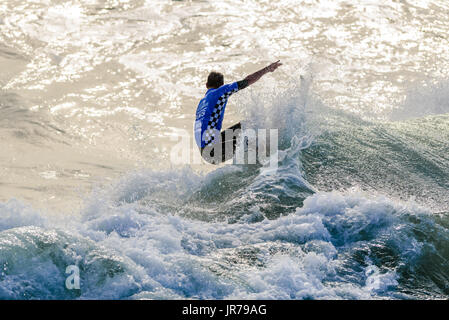 Huntington Beach, USA. 03 August, 2017. Brett Simpson connects a long wave to the inside section at the 2017 VANS US Open of Surfing. Credit: Benjamin Ginsberg/Alamy Live News. Stock Photo