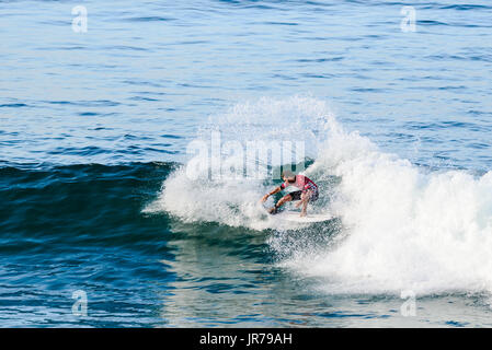 Huntington Beach, USA. 03 August, 2017. Frederico Morals (PRT) releases his fins and carves a powerful turn at the 2017 VANS US Open of Surfing. Credit: Benjamin Ginsberg/Alamy Live News. Stock Photo