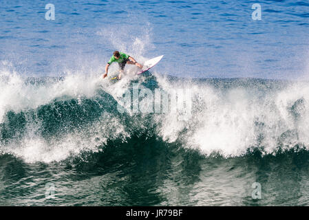 Huntington Beach, USA. 03 August, 2017. Kiron Jabour (USA-Hawaii) floats the lip at the 2017 VANS US Open of Surfing. Credit: Benjamin Ginsberg/Alamy Live News. Stock Photo