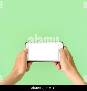Template of a woman holding a smart device tablet or phone with clipping path for overlays Stock Photo