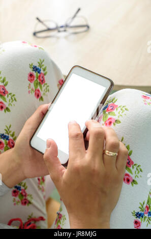 Woman holding a Smart Phone device with clipping path for VR augmented reality overlay Stock Photo