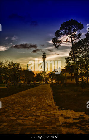 July 2017, Port St. Joe, Florida: The Cape San Blas lighthouse at the end of the path just after sunset. Stock Photo