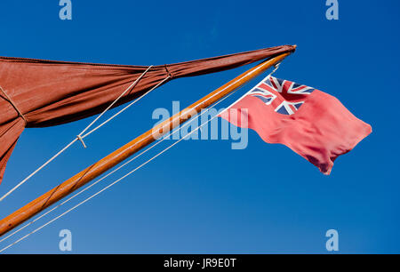 Red ensign flag on a wooden mast Stock Photo