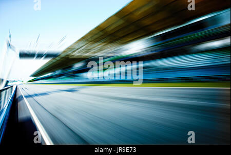 Racetrack in motion blur, racing sport background . Stock Photo