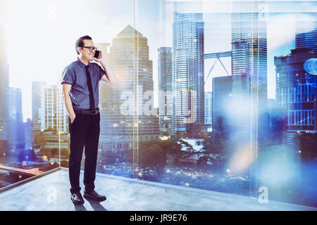 Full length portrait of happy 30s 40s Asian businessman . Stock Photo