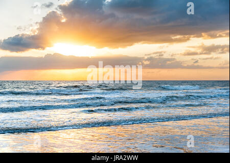 Early morning sun breaking through the clouds at Mickler Beach in Ponte Vedra Beach, Florida. (USA) Stock Photo