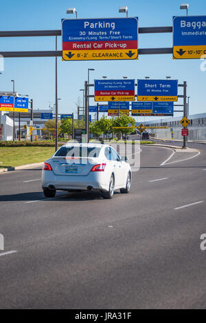 Airport parking and rental car signage over the entry lanes at Memphis International Airport in Memphis, Tennessee, USA. Stock Photo