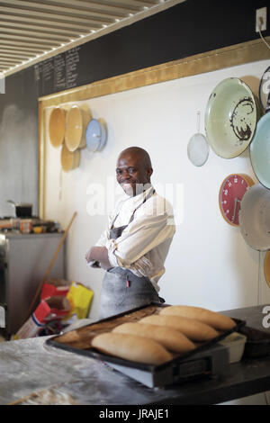Baker working in commercial kitchen Stock Photo