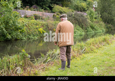 Fly fisherman fishing on the river Test, Wherwell Trout Fishery , Andover, Hampshire, England, United Kingdom. Stock Photo