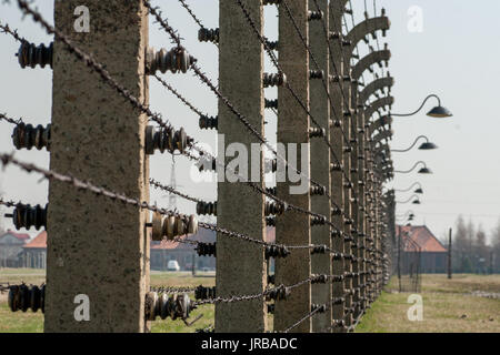 Electric barbed wire fence in former Nazi Concentration Camp Auschwitz-Birkenau, Oswiecim Brzezinka, Poland Stock Photo