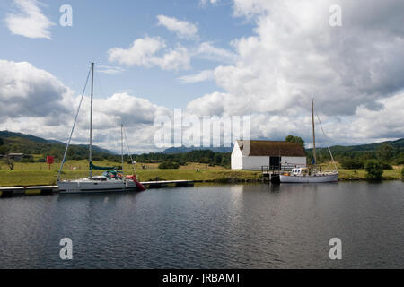 Scenic view with yachts parked in the docking pier on the Loch Ness Scottish Highlands, near Fort Augustus, Scotland Stock Photo