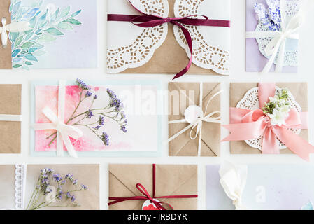 top view of collection of envelopes or invitations isolated on white, wedding invitation card design concept  Stock Photo