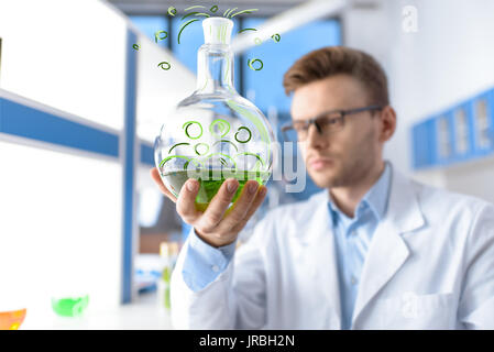 chemist holding flask  Stock Photo