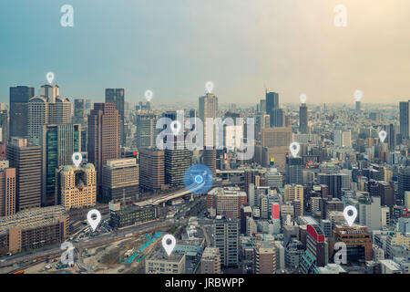 Searching location on map and pin above Osaka city and network connection, internet of things, satellite navigation system concept Stock Photo