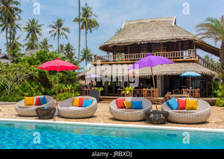 Tropical resort with a swimming pool and cafe bar on Koh Kood island, thailand