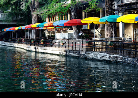 Colorful umbrellas reflected on San Antonio River, Riverwalk, San Antonio, Texas USA Stock Photo