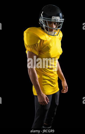 Portrait of American football player with a head gear Stock Photo