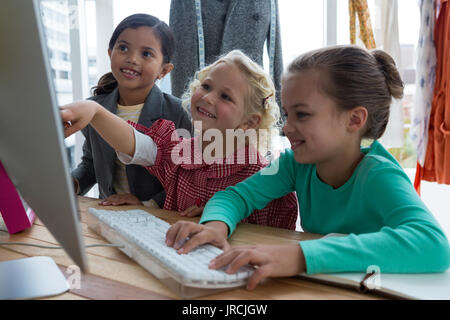 Female designers planning over computer in creative office Stock Photo