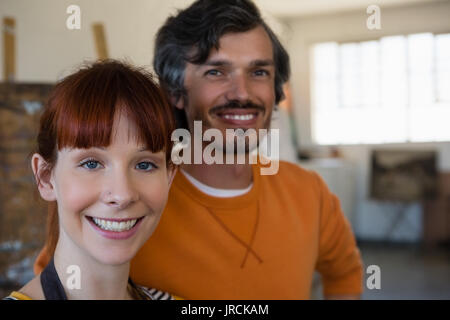 Close up portrait of smiling friends in art class Stock Photo