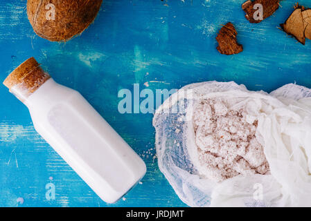 Top view of an Homemade coconut milk in a bottle, made after mixing coconut and water  in a blender and pressed through a cotton sieve, with coconut m Stock Photo