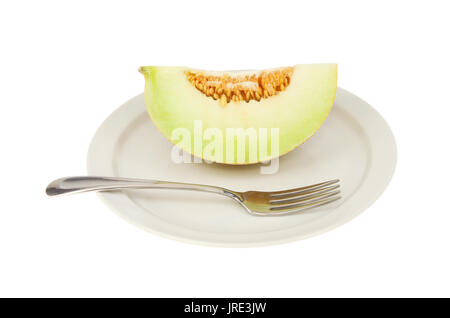 Galia melon portion on a plate with a fork isolated against white Stock Photo