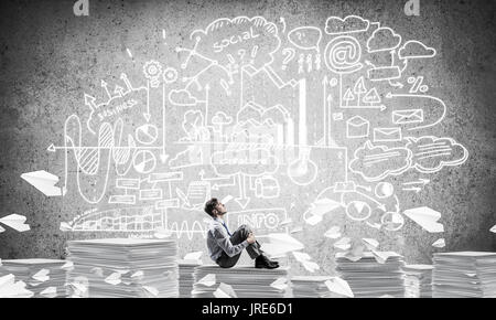 Businessman dreaming about future business. Stock Photo