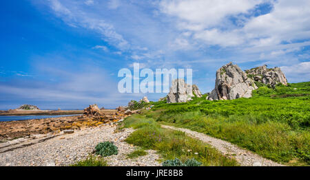 France, Brittany, Cotes-d'Armor department, coastal hiking trail along the rocky shores of the Gouffre de Plougrescant on the Côte de granit rose, Pin Stock Photo