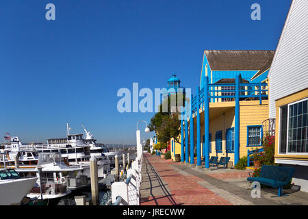 The stores in Fisherman's Village, Marina Del Rey, California, are near boats of all sizes. Stock Photo
