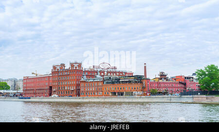 MOSCOW, RUSSIA - MAY 11, 2015:  The beautiful red buildings of former Red October chocolate factory nowadays serves as office and leisure complex, on  Stock Photo