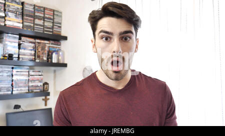 Surprised, shocked young man looking at camera Stock Photo