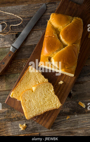 Homemade Sweet Brioche Bread Loaf Cut into Slices Stock Photo