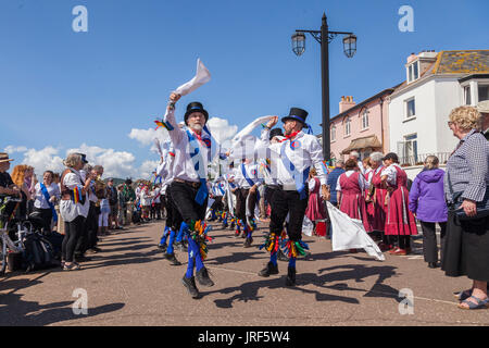 Sidmouth, 5th Aug 17. Morris Men perform on the seafront at Sidmouth during the Folk Week Festival. The folk festival has been running since 1955, attracts tens of thousands of visitors, and will see over 700 events before the final concert on the 11th August.Credit: South West Photos / Alamy Live News Stock Photo