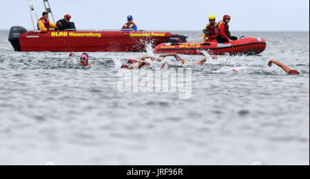Prerow, Germany. 5th Aug, 2017. Life-guards in action during the DLRG trophy 'Contest in open sea rescue swimming' at the beach of Prerow, Germany, 5 August 2017. The contest includes three competitions; the first was in Haltern-am-See, the third will be Langlau, Germany. Photo: Stefan Sauer/dpa-Zentralbild/dpa/Alamy Live News Stock Photo