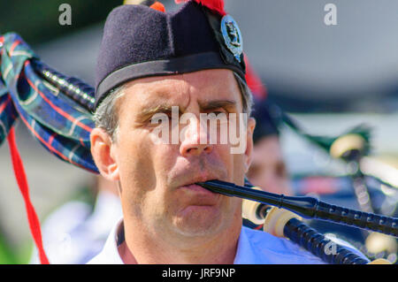Dundonald, Scotland, UK. 5th August, 2017. A male member of the pipe band plays the bagpipes. Dundonald Highland Games celebrates  traditional Scottish culture with a pipe band contest, drum majors, solo piping, highland dancing, heavy events, side stalls, massed pipe bands, a street procession and is held in the picturesque setting of Royal Dundonald Castle.  Credit: Skully/Alamy Live News Stock Photo