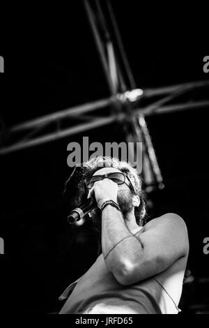 Edward Sharpe and the Magnetic Zeros performing at a music festival in British Columbia Canada in black and white. Stock Photo