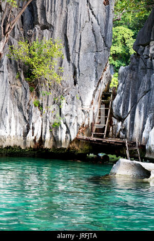 blur in philippines view from a boat of  palm cliff beach and rock from pacific ocean Stock Photo