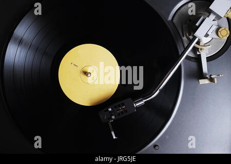 Old vinyl playing on a turntable. Retro and vintage themes Stock Photo