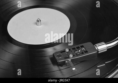 Old vinyl playing on a turntable. Retro and vintage themes Stock Photo
