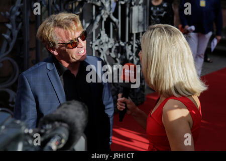 Worms, Germany. 04th Aug, 2017. German actor Andre Eisermann gives an interview on the red carpet. Actors, politicians and other VIPs attended the opening night of the 2017 Nibelung Festival in Worms. The play in the 16. Season of the festival is called ‘Glow - Siegfried of Arabia' from Albert Ostermaier. Credit: Michael Debets/Pacific Press/Alamy Live News Stock Photo