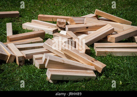 Wooden blocks for game lying on grass. Stock Photo