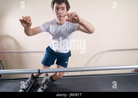 MOSCOW, RUSSIA - September 23, 2010 - Athlete working out on interactive ski simulator at the gym Stock Photo