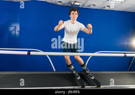 MOSCOW, RUSSIA - September 23, 2010 - Athlete working out on interactive ski simulator at the gym Stock Photo